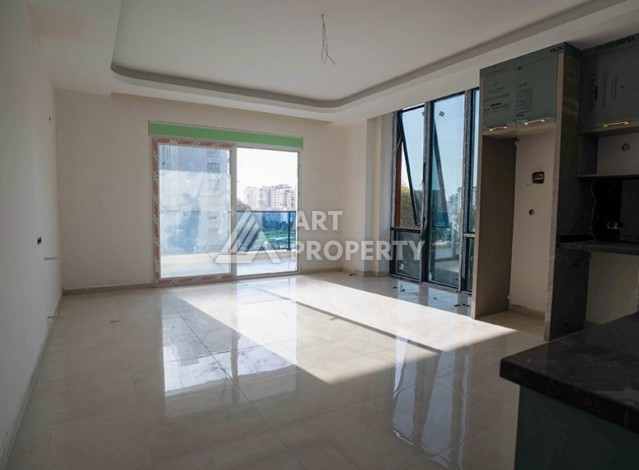 Двухкомнатная квартира 54 кв.м. в элитной резиденции. Центр района Махмутлар. - Ракурс 2