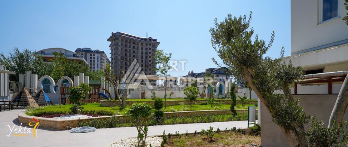 Двухкомнатная квартира 54 кв.м. в элитной резиденции. Центр района Махмутлар. - Ракурс 9