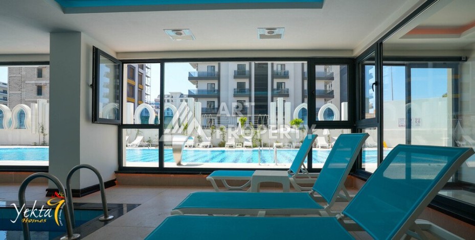 Двухкомнатная квартира 54 кв.м. в элитной резиденции. Центр района Махмутлар. - Ракурс 25