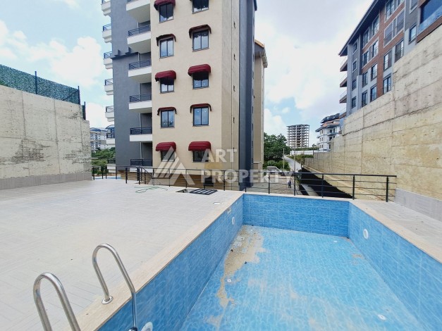 Квартира 1+1 с видом на бассейн в районе Авсаллар, 55 кв.м. - Ракурс 21