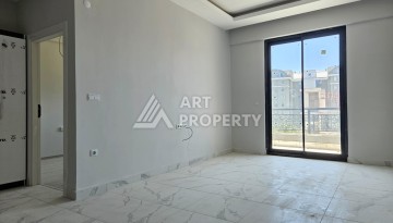 Южная квартира 1+1 в центре Авсаллара, новая резиденция, 55 кв.м. - Ракурс 7
