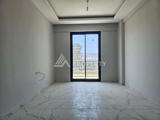 Южная квартира 1+1 в центре Авсаллара, новая резиденция, 55 кв.м. - Ракурс 13