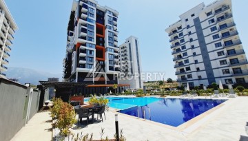 Готовые квартиры с рассрочкой, 1+1 в центре Махмутлара, 49 кв.м. - Ракурс 1