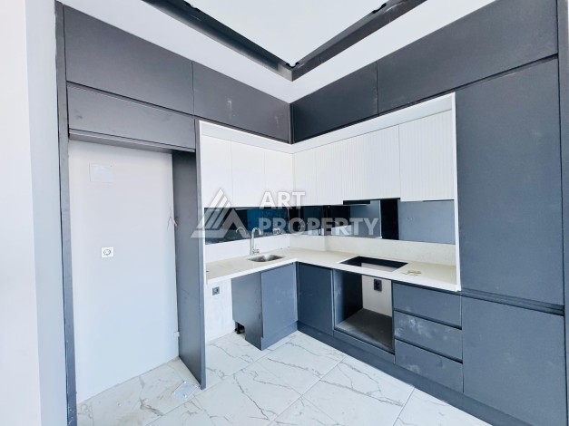 Готовые квартиры с рассрочкой, 1+1 в центре Махмутлара, 49 кв.м. - Ракурс 45