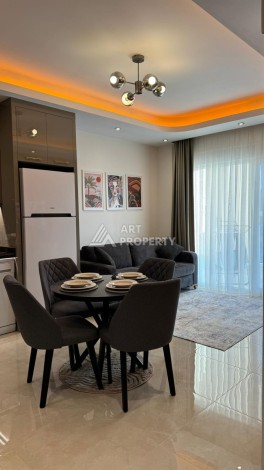 Стильная квартира 1+1 для отдыха и аренды, 500 м от моря в центре Махмутлара - Ракурс 2