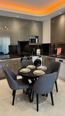 Стильная квартира 1+1 для отдыха и аренды, 500 м от моря в центре Махмутлара - Ракурс 6