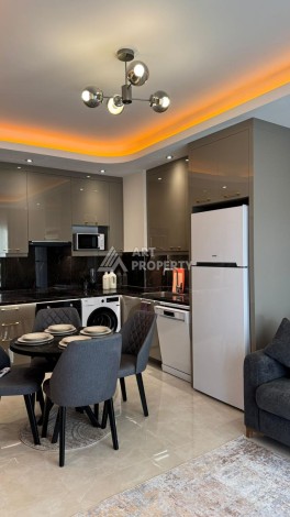 Стильная квартира 1+1 для отдыха и аренды, 500 м от моря в центре Махмутлара - Ракурс 7