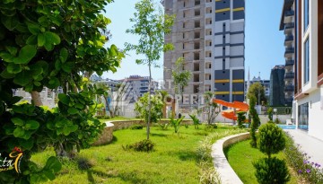 Стильная квартира 1+1 для отдыха и аренды, 500 м от моря в центре Махмутлара - Ракурс 72