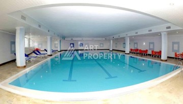 Квартира 2+1 в престижном ЖК всего 650 м от моря в Махмутларе - Ракурс 12