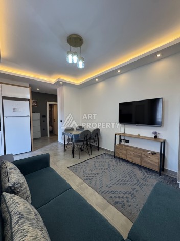 Квартира 1+1 с мебелью, 350 м от моря в центре Махмутлара - Ракурс 13