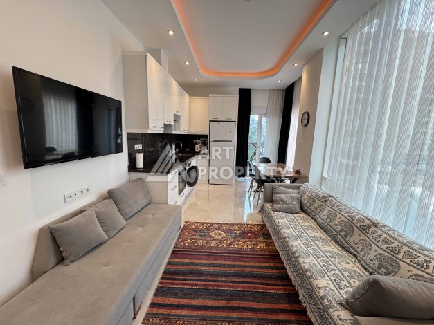 Меблированная квартира 1+1 в Махмутларе, всего 300 м от моря - Ракурс 18