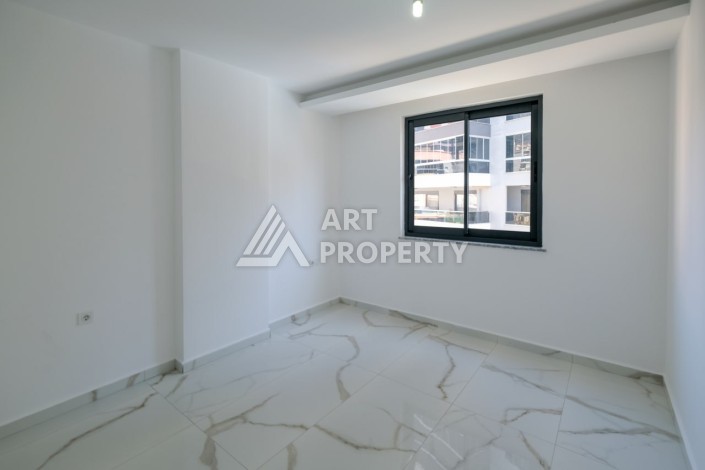 Квартира 1+1 площадью 60 м² в новом комплексе района Махмутлар по выгодной цене - Ракурс 2