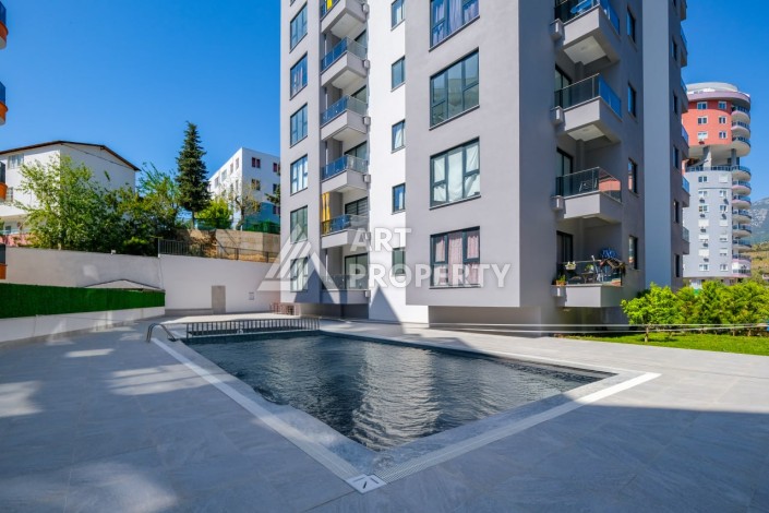 Квартира 1+1 площадью 60 м² в новом комплексе района Махмутлар по выгодной цене - Ракурс 18