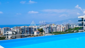 Меблированная квартира 1+1 с видом на море и горы в Махмутларе, в комплексе с бассейном на крыше - Ракурс 2