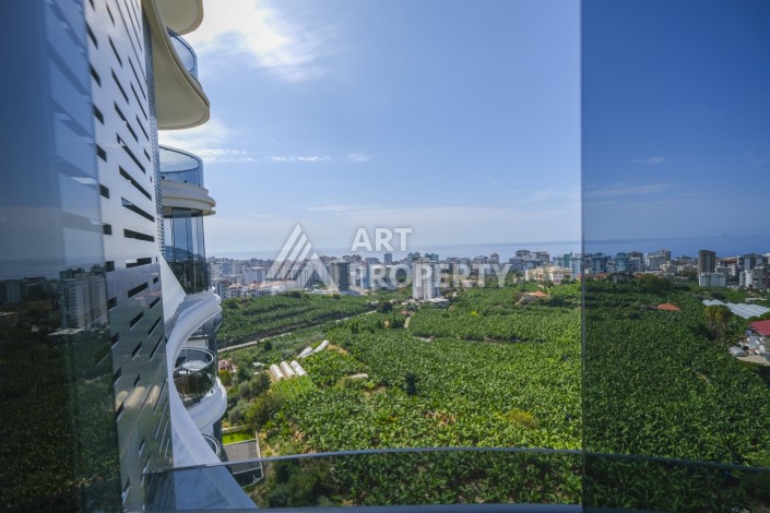 Меблированная квартира 1+1 с видом на море и горы в Махмутларе, в комплексе с бассейном на крыше - Ракурс 25