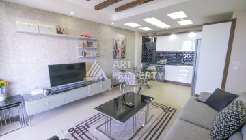 Меблированная квартира 1+1 с видом на море и горы в Махмутларе, в комплексе с бассейном на крыше - Ракурс 27