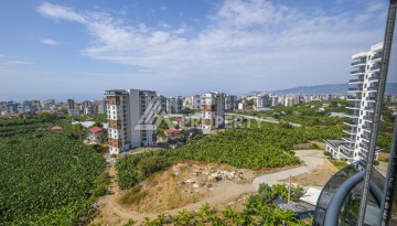 Меблированная квартира 1+1 с видом на море и горы в Махмутларе, в комплексе с бассейном на крыше - Ракурс 31