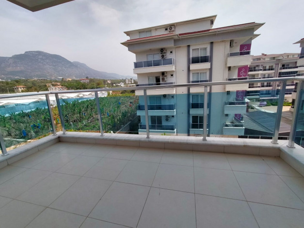 Уютные трехкомнатные апартаменты у Средиземного моря в элитном районе Кестель,Алания, 90 м2. - Ракурс 21