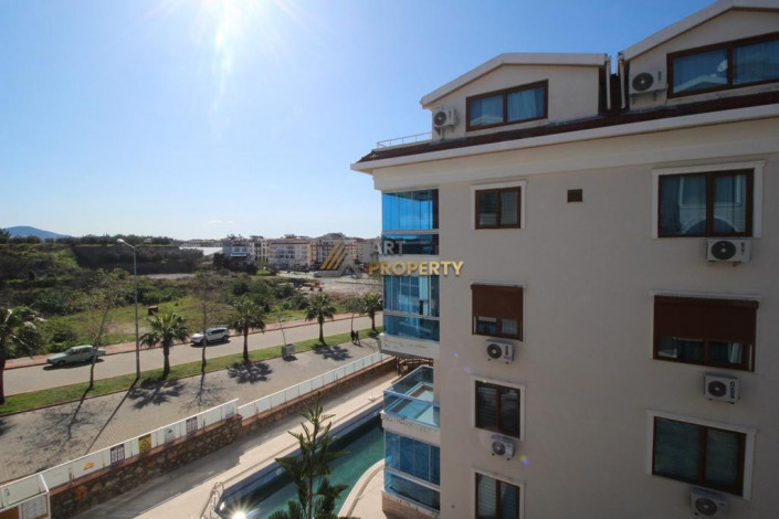 Большие по площади двухкомнатные апартаменты 1+1 в 300 метрах от моря, 60 м2 - Ракурс 11