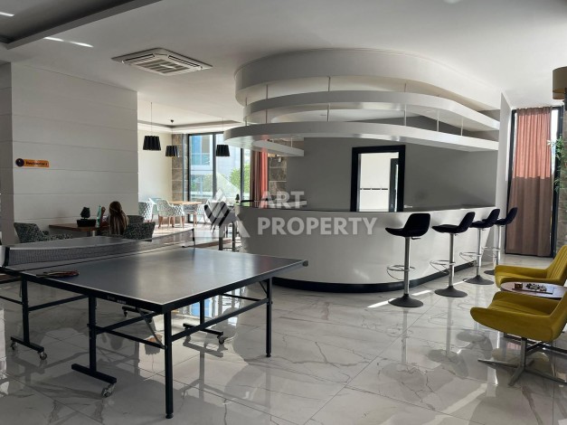 Стильная квартира 1+1 с видом на море в престижном комплексе района Тосмур, всего в 400 метрах от пляжа - Ракурс 6