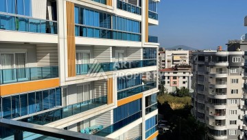 Стильная квартира 1+1 с видом на море в престижном комплексе района Тосмур, всего в 400 метрах от пляжа - Ракурс 8