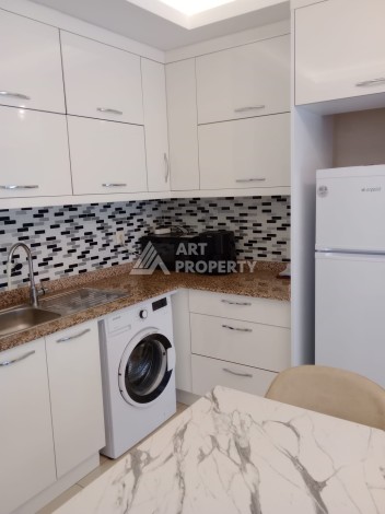 Квартира 1+1 с мебелью в районе Оба, всего в 250 метрах от моря — отличное предложение для жизни и инвестиций - Ракурс 1