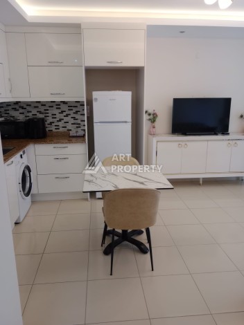 Квартира 1+1 с мебелью в районе Оба, всего в 250 метрах от моря — отличное предложение для жизни и инвестиций - Ракурс 5