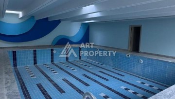 Современная квартира 1+1 в 600 м от пляжа Клеопатры. Новая резиденция в центре Алании - Ракурс 9