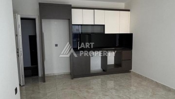 Современная квартира 1+1 в 600 м от пляжа Клеопатры. Новая резиденция в центре Алании - Ракурс 18