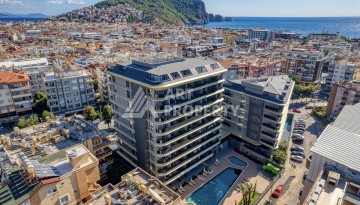 Квартира 1+1 в премиальном комплексе в центре Алании, всего в 400 метрах от пляжа Клеопатра - Ракурс 1