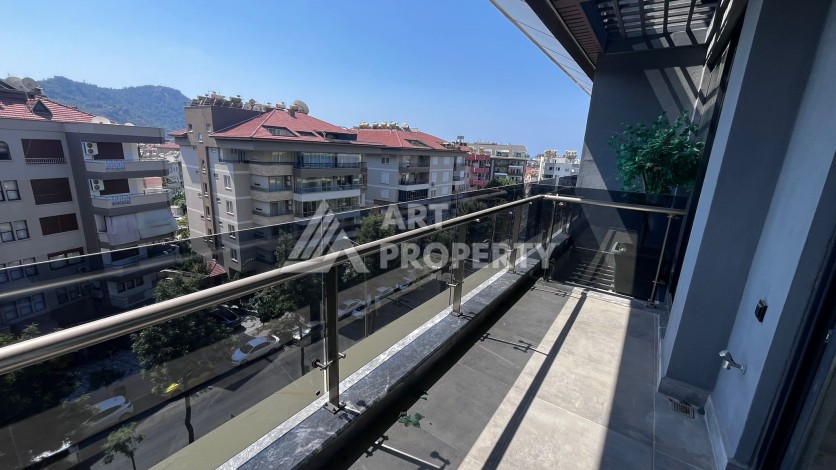 Квартира 1+1 в премиальном комплексе в центре Алании, всего в 400 метрах от пляжа Клеопатра - Ракурс 18