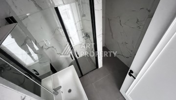 Квартира 1+1 без мебели в новом комплексе в центре Алании, всего 400 метров от пляжа Клеопатра - Ракурс 3