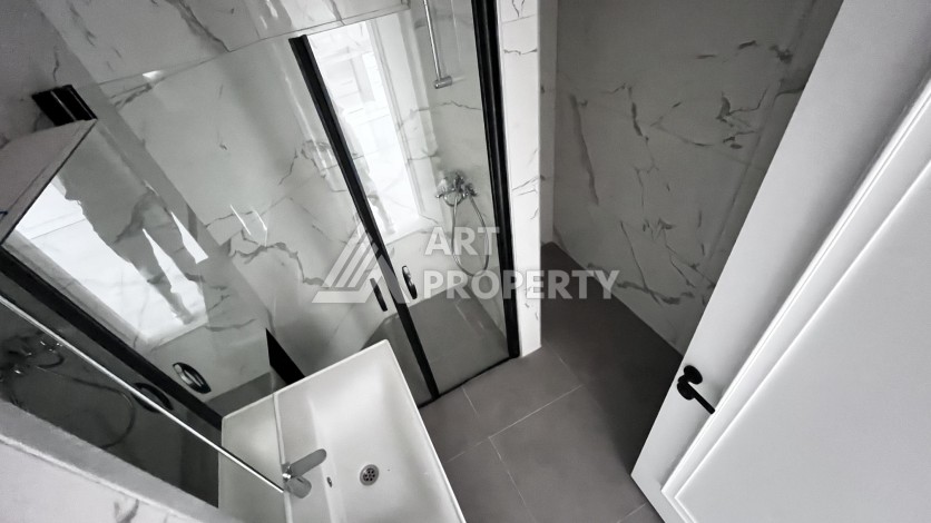 Квартира 1+1 без мебели в новом комплексе в центре Алании, всего 400 метров от пляжа Клеопатра - Ракурс 2