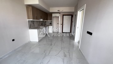 Квартира 1+1 без мебели в новом комплексе в центре Алании, всего 400 метров от пляжа Клеопатра - Ракурс 5