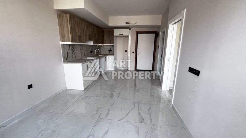 Квартира 1+1 без мебели в новом комплексе в центре Алании, всего 400 метров от пляжа Клеопатра - Ракурс 4