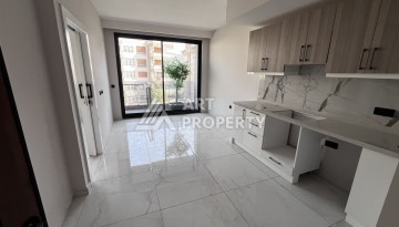 Квартира 1+1 без мебели в новом комплексе в центре Алании, всего 400 метров от пляжа Клеопатра - Ракурс 7