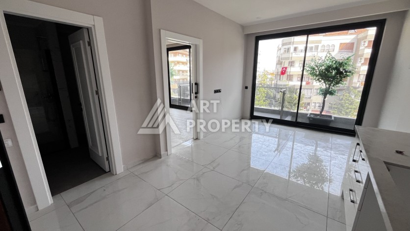 Квартира 1+1 без мебели в новом комплексе в центре Алании, всего 400 метров от пляжа Клеопатра - Ракурс 7