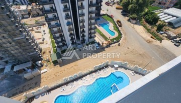 Квартира 1+1 с разрешением на сдачу в аренду в премиальном комплексе Махмутлара - Ракурс 21