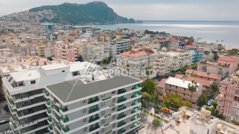 Квартира 1+1 в 200 м от пляжа Клеопатры. Новый дом в центре Алании - Ракурс 0