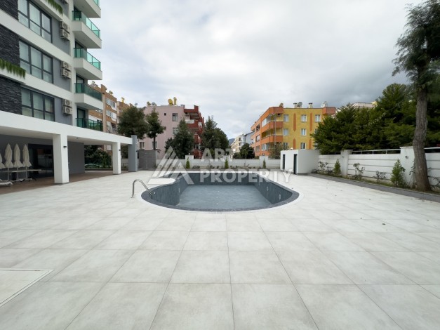 Квартира 1+1 в 200 м от пляжа Клеопатры. Новый дом в центре Алании - Ракурс 4