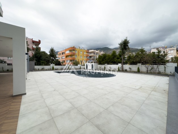 Квартира 1+1 в 200 м от пляжа Клеопатры. Новый дом в центре Алании - Ракурс 5