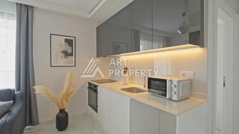 Квартира 1+1 в 200 м от пляжа Клеопатры. Новый дом в центре Алании - Ракурс 18