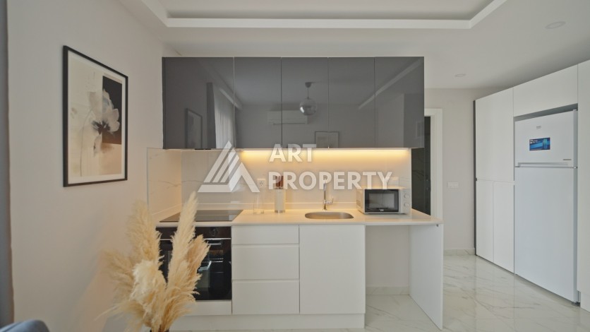 Квартира 1+1 в 200 м от пляжа Клеопатры. Новый дом в центре Алании - Ракурс 19