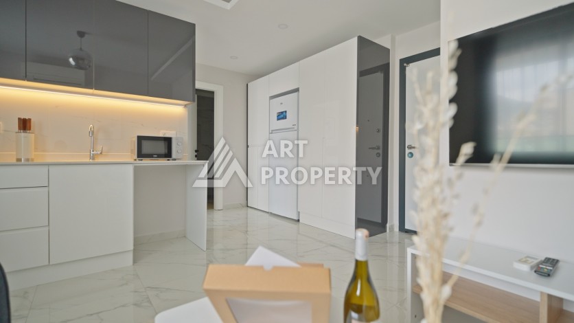 Квартира 1+1 в 200 м от пляжа Клеопатры. Новый дом в центре Алании - Ракурс 21