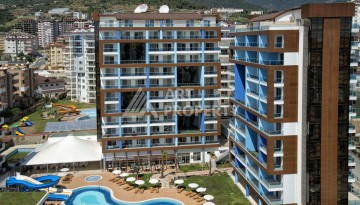 Квартира 1+1 с видом на бассейн, 65 кв.м. Джикджилли, Алания - Ракурс 1