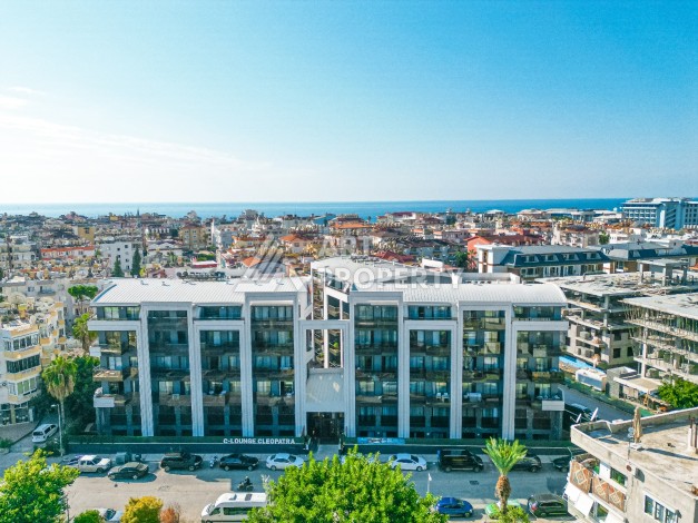 Стильная квартира 1+1 с дизайнерским интерьером в премиальном комплексе у пляжа Клеопатры - Ракурс 0