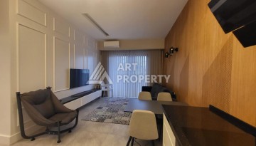 Стильная квартира 1+1 с дизайнерским интерьером в премиальном комплексе у пляжа Клеопатры - Ракурс 7