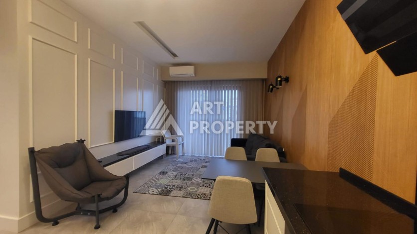 Стильная квартира 1+1 с дизайнерским интерьером в премиальном комплексе у пляжа Клеопатры - Ракурс 6