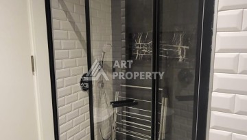 Стильная квартира 1+1 с дизайнерским интерьером в премиальном комплексе у пляжа Клеопатры - Ракурс 13