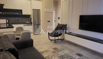 Стильная квартира 1+1 с дизайнерским интерьером в премиальном комплексе у пляжа Клеопатры - Ракурс 14